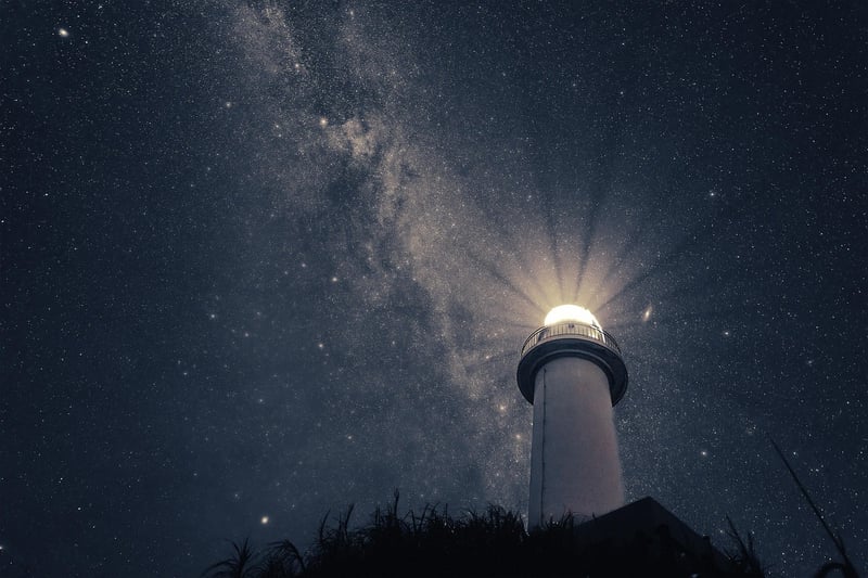 Person meditating under the stars